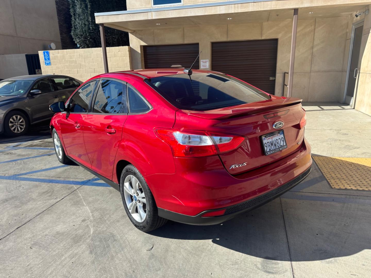 2012 RED /BLACK Ford Focus SE Sedan (1FAHP3F29CL) with an 2.0L L4 DOHC 16V engine, AUTOMATIC transmission, located at 30 S. Berkeley Avenue, Pasadena, CA, 91107, (626) 248-7567, 34.145447, -118.109398 - New Tires! Nice Interior! drives and looks good! Bad credit? We can help! We are the bank. All our cars are thoroughly inspected and reconditioned by our technicians. FREE CARFAX report. Stop by or call to speak with our friendly staff. Whether you have bad credit, no credit, bankruptcy, or reposse - Photo#2